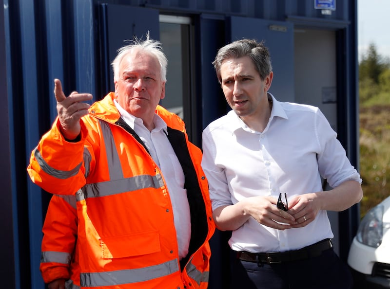 Simon Harris and Jon Hill, left, from the Independent Commission for the Location of Victims' Remains, at Bragan Bog in Co Monaghan. Photograph: Peter Morrison/PA Wire