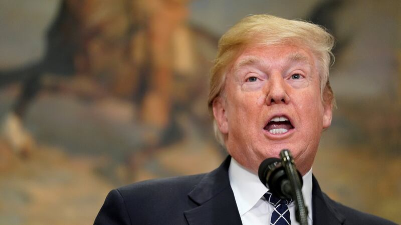 US president Donald Trump signed a proclamation to honor Martin Luther King Jr day in Washington on Friday, after the UN condemned reports of comments the president made about immigrants from ‘sh**thole countries’ as ‘shocking and shameful’. Photograph: Joshua Roberts/Reuters