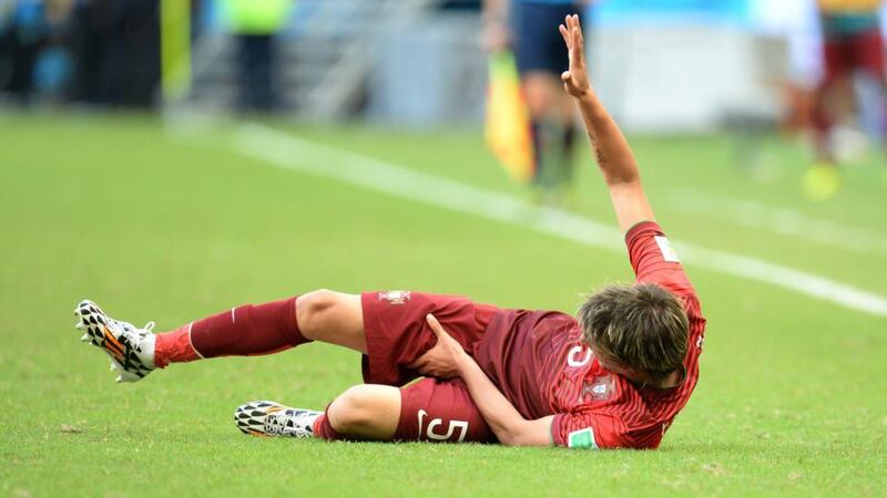 Ouch! Portugal’s Fabio Coentrao was left reeling by a freak injury during the defeat to Germany at the Arena Fonte Nova in Salvador. Photograph: EPA