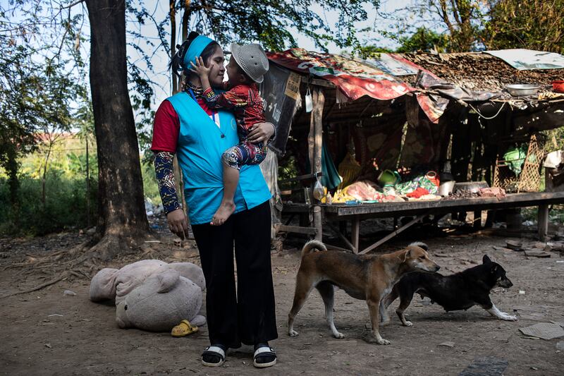 Hun Daneth with the three-year-old boy she birthed as a surrogate. Photograph: Nadia Shira Cohen/The New York Times