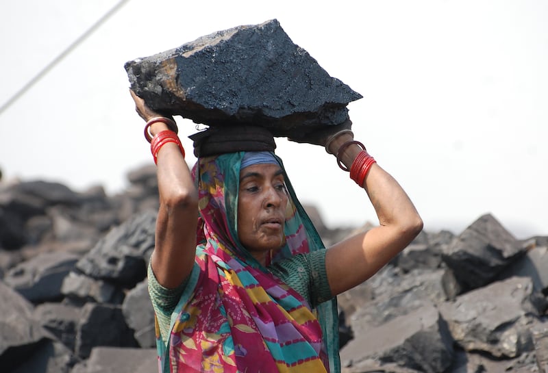 An Indian coal loader works during International Women's Day. Photograph: AFP/Getty Images