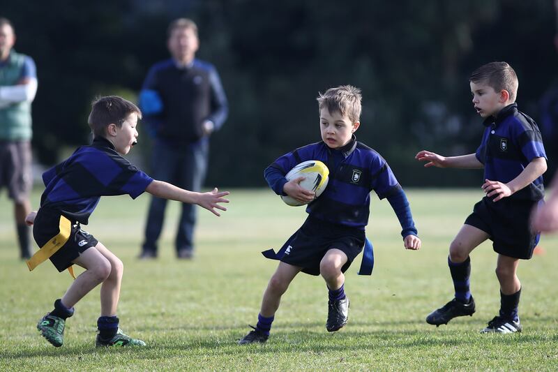 Children playing rugby in Auckland, New Zealand, in 2017. Photograph: Phil Walter/Getty Images