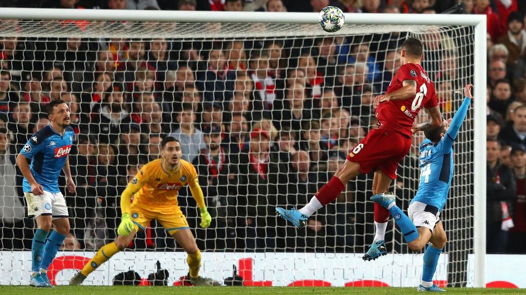 Dejan Lovren heads home Liverpool’s equaliser during the Champions League Group E match against Napoli at Anfield. Photograph: Michael Steele/Getty Images