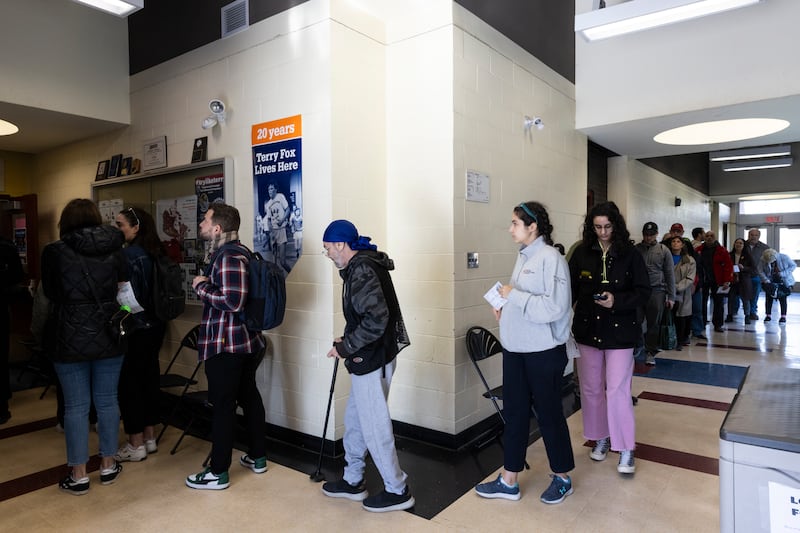 Canada: Voters wait in line at a polling station. Photograph: Nasuna Stuart-Ulin/The New York Times