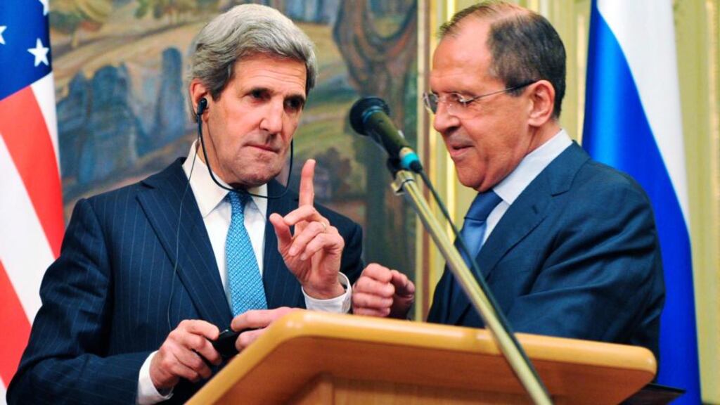 US secretary of state John Kerry (left) gestures as Russian foreign minister Sergei Lavrov tries to fix his translation equipment during a joint news conference after their meeting in Moscow yesterday. Russia and the United States have agreed to try to arrange an international conference this month on ending the civil war in Syria, and said both sides in the conflict should take part. Photograph: Mladen Antonov/Reuters