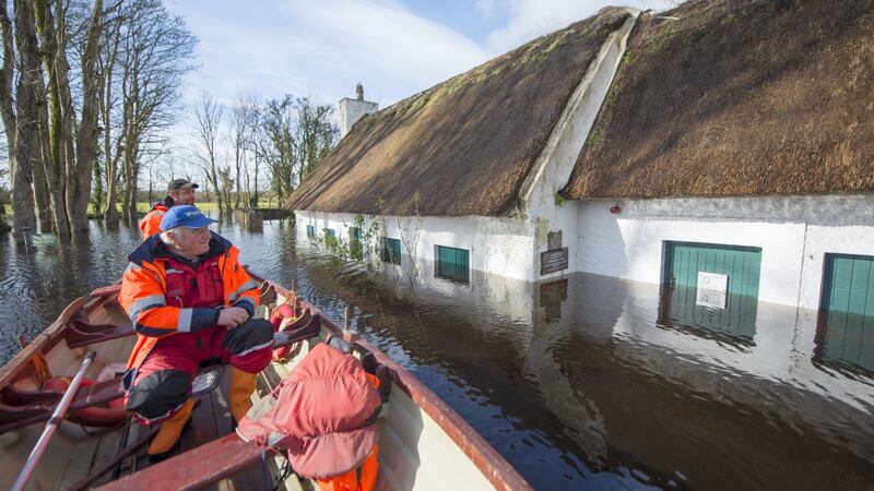 James and Jimmy Curley from Gort passing Thoor Ballylee in Gort. Photograph John Mangan