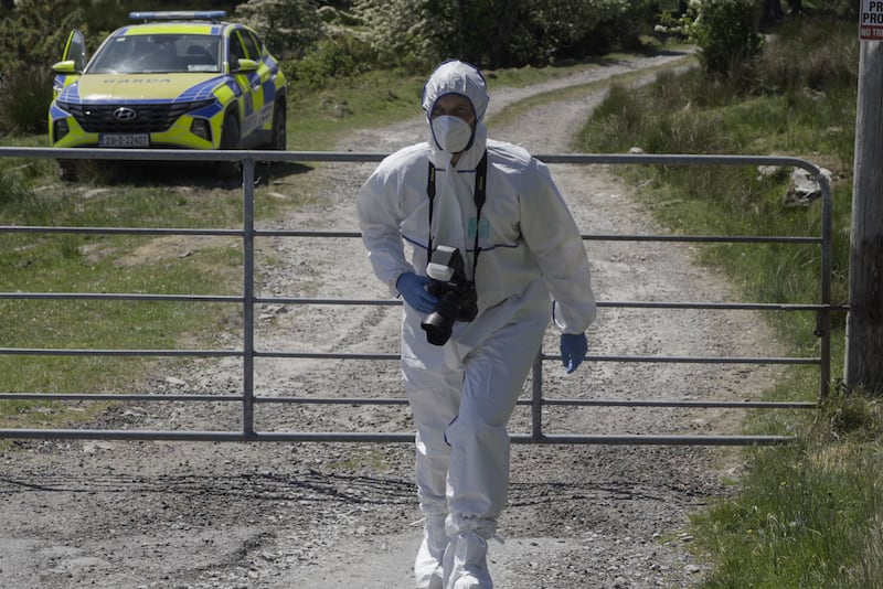 A member of Garda Technical Unit at the scene of the search of missing farmer Michael Gaine's farm in Carrig East, Kenmare. Photograph: Noel Sweeney/PA Wire