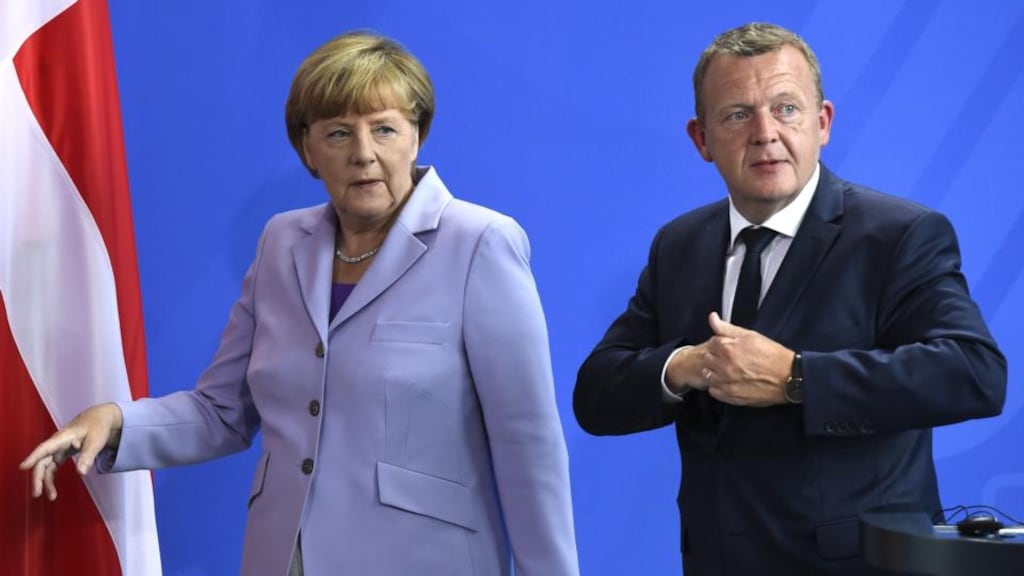 German chancellor Angela Merkel and Danish prime minster Lars Loekke Rasmussen: A poll on Monday suggested that 78 per cent of Danes want their country to participate in the EU distribution plan. Photograph: Tobias Schwarz/AFP/Getty Images