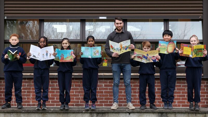 Fourth class pupils, from left, Aleksander, Nelly, Adhira, Roshnirashmita, Darragh, Shane and Khloe, with teacher Phil McCarthy at Mother of Divine Grace school, Ballygall, Dublin. Photograph: Laura Hutton
