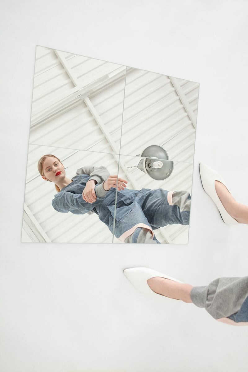 Jumpsuit with denim puff sleeve and jersey panels €225, white flat pumps Mango €49.95, silver disc earring €25 Om Diva