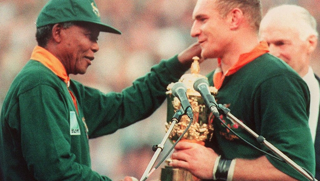 South African president Nelson Mandela congratulates Francois Pienaar after he captained the South African side that won the 1995 Rugby World Cup in Johannesburg. Photograph: Jean-Pierre Muller/Getty