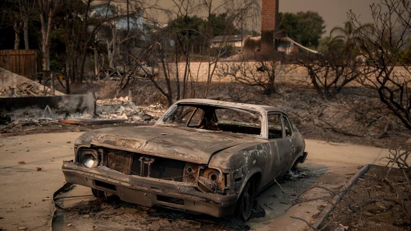 A car destroyed by the Thomas Fire in the foothills of Ventura, California. Photograph: Hilary Swift/The New York Times
