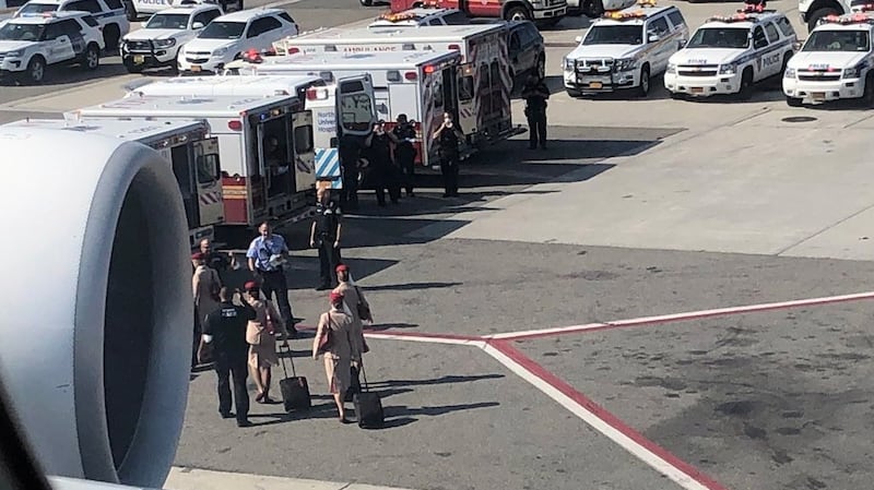 Photo released with permission via Twitter user @LarryCoben  shows the cabin crew deplaning from Emirates flight. Photograph: EPA/@LarryCoben via Twitter