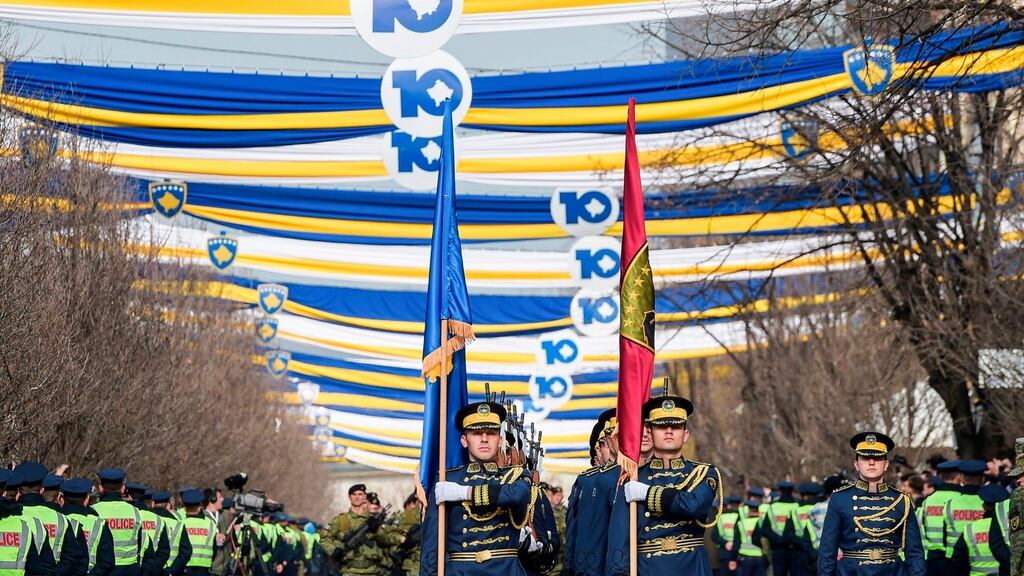 Members of the Kosovo Security Force ceremonial band parade in the main square in Pristina on the occasion of the 10th anniversary of Kosovo Independence. Photograph: Armend Nimani/AFP/Getty Images