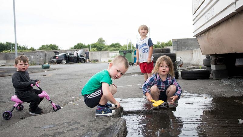 Declan Jnr Ward, Thomas Ward, Tom Ward and Demelia Ward playing at St Mary’s Halting Site, Cappagh Road, Finglas, Dublin. Photograph: Tom Honan