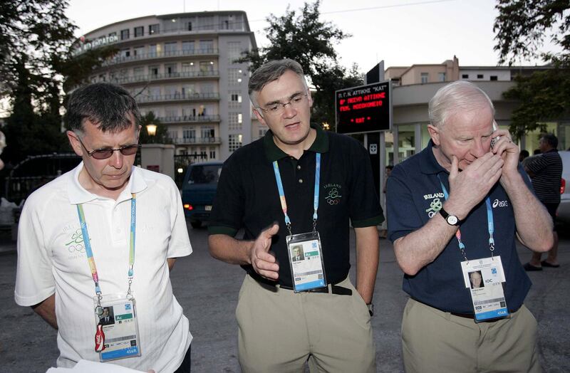 Willie O'Brien, chef d'équipe of the Irish Olympic team, Dr Seán Gaine and Pat Hickey brief the press about Jamie Costin's condition outside the KAT hospital in Athens in August 2004. Photograph: Patrick Bolger/Inpho