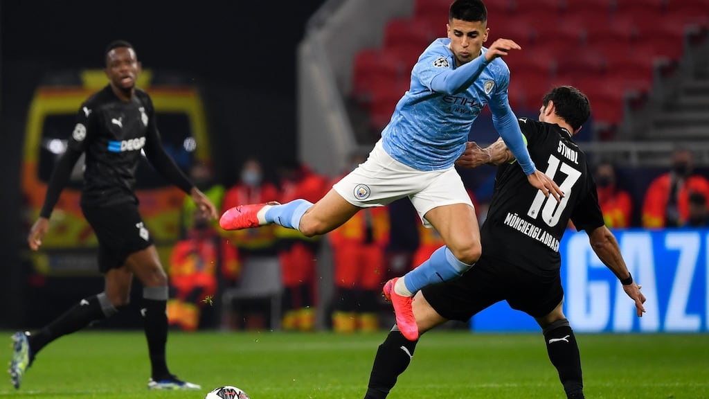 Manchester City’s João Cancelo battles with Borussia Mönchengladbach’s Lars Stindl during the Champions League round of 16, first-leg match at Puskas Arena in Budapest. Photograph: PA Wire via DPA