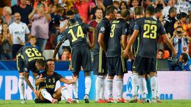 Juventus win in Valencia despite Ronaldo sending off