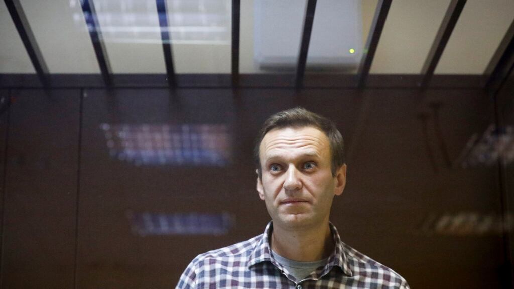 Russian opposition leader Alexei Navalny stands in a cage in the Babuskinsky District Court in Moscow, Russia. Photograph: Alexander Zemlianichenko File/AP