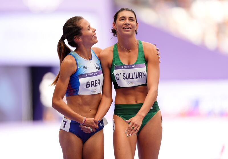 Sophie O'Sullivan with Venezuela's Joselyn Brea after the Irish runner came fourth in her 1,500m repechage at the Stade de France. Photograph: Martin Rickett/PA Wire