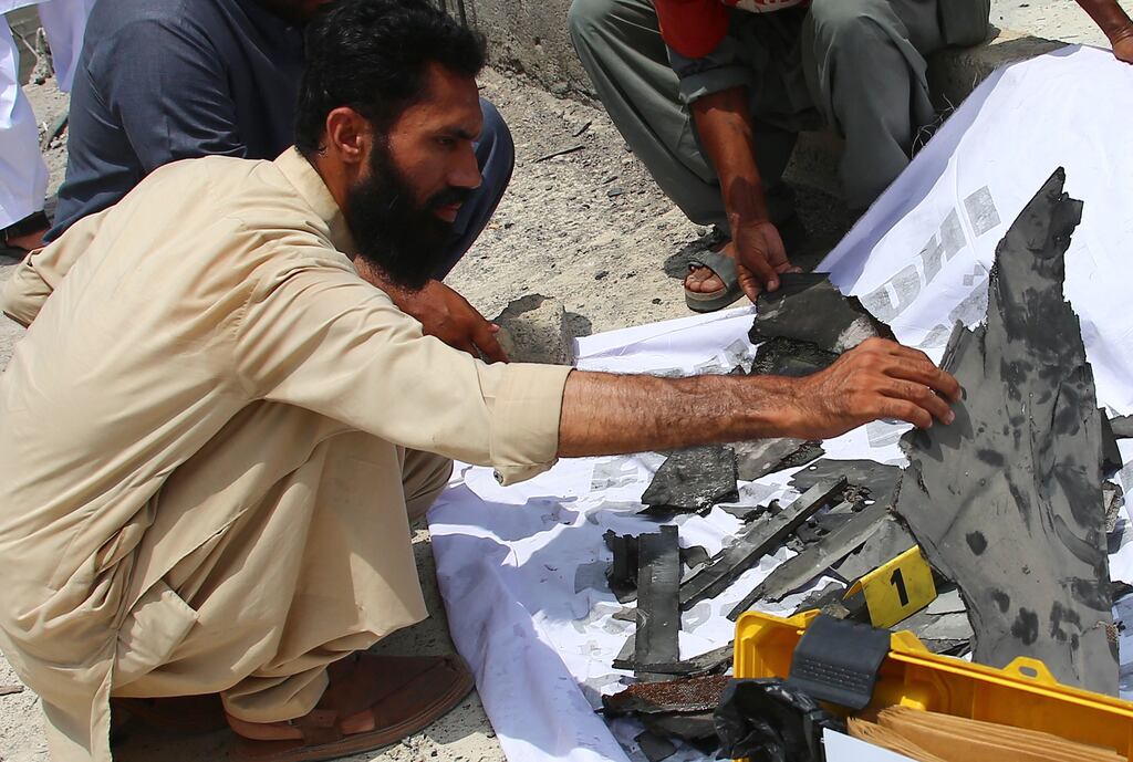 A man inspects debris at the site of an alleged Indian drone strike in Karachi, Pakistan, on Thursday. Photograph: Rehan Khan/EPA