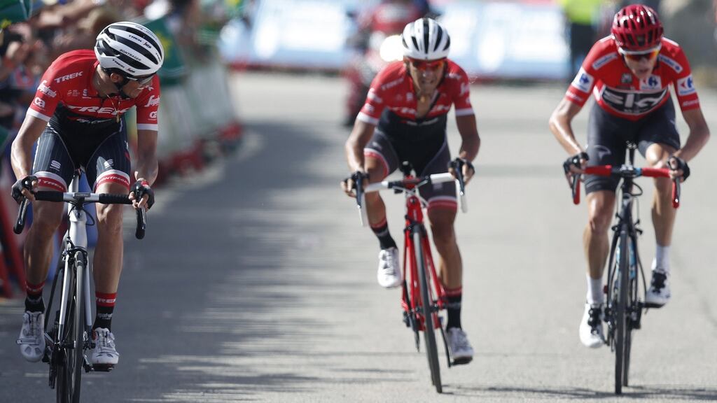Alberto Contador (left) of Trek Segafredo looks over his shoulder at Sky’s Chris Froome as he crosses the finish line in the eighth stage of Vuelta a Espana between Hellin and Xorret de Cati. Photograph: Javier Lizon/EPA