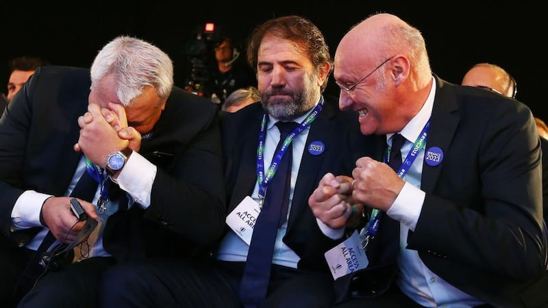 France 2023: Bernard Laporte (right), celebrates with the president of the French bid, Claude Atcher, and FFR vice-president Serge Simon as they’re named host nation. Photograph: Jordan Mansfield/WR/HO/AFP/Getty