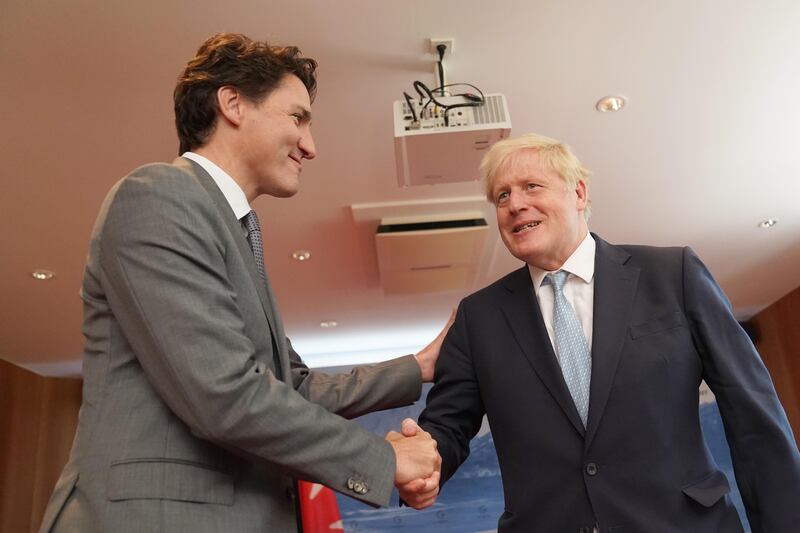 Boris Johnson with Justin Trudeau (Stefan Rousseau/PA)