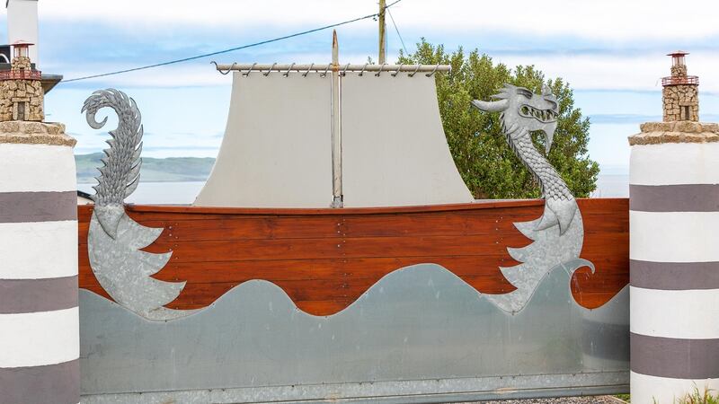 The Viking-themed electric gates at the entrance to the house.