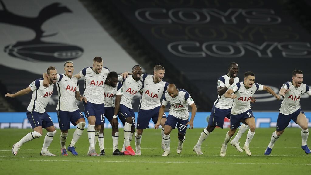 Tottenham’s players celebrate after winning on penalties against Chelsea in the Carabao Cup fourth round. Photo: Matt Dunham/EPA
