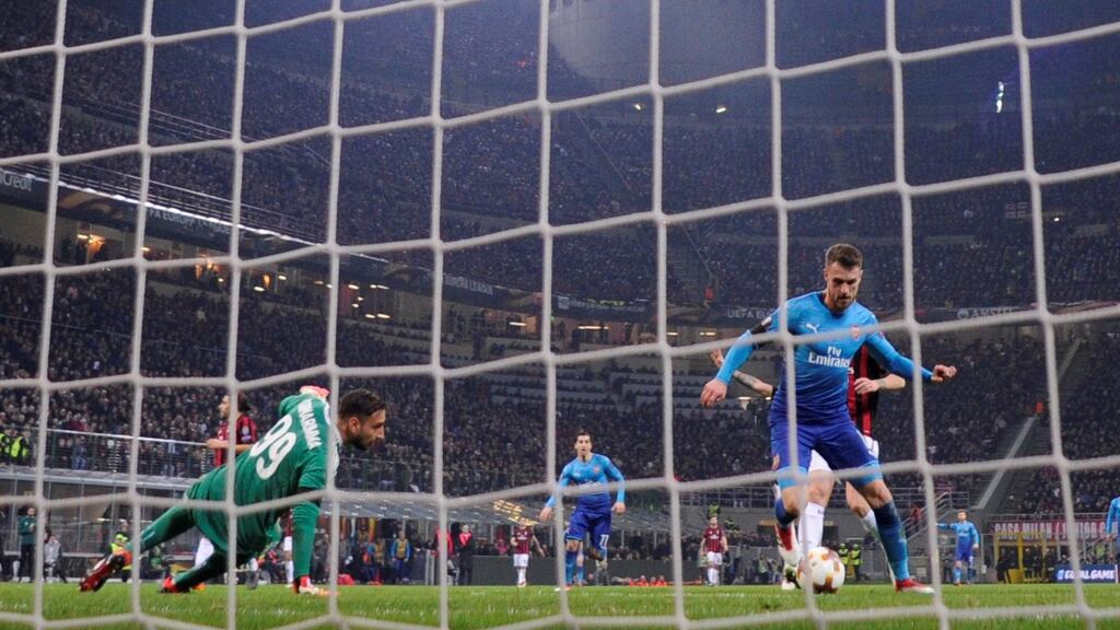 Aaron Ramsey scores Arsenal’s  second goal in the Europa League round of 16 first  leg against AC Milan  at the San Siro stadium. Photograph:   Alberto Lingria/Reuters