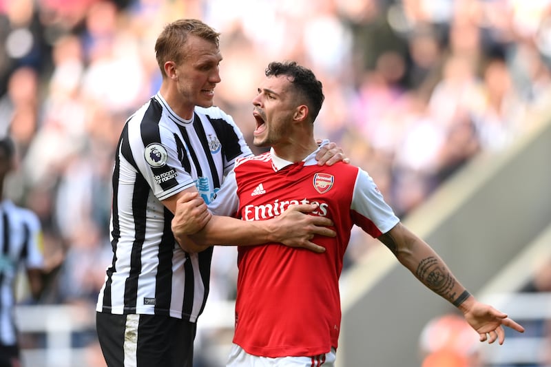 Dan Burn (left) with Granit Xhaka during the Premier League match between Newcastle United and Arsenal FC at St James' Park. Photograph: Stu Forster/Getty Images