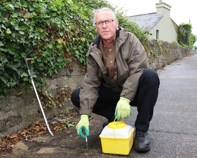 Cathal McCarthy showing the needles he has found in his area near Hyde Road. Photograph: Brendan Gleeson