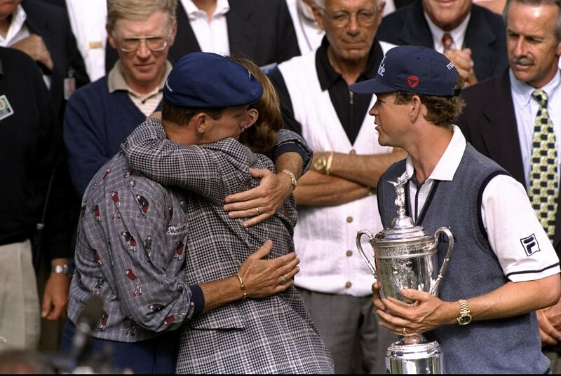 Payne Stewart of the USA hugs Beverly Janzen as Lee Janzen looks on in June 21st, 1998, during the US Open on the Lake Course at The Olympic Club in San Francisco, California. Photograph: