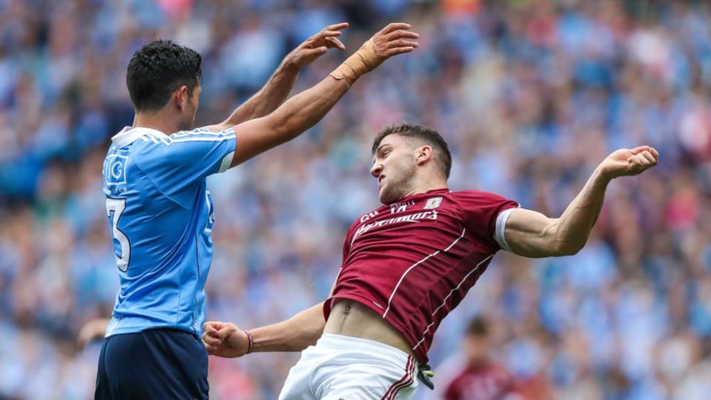 Cian O’Sullivan of Dublin and Damien Comer of Galway. Photograph: Tommy Dickson/Inpho