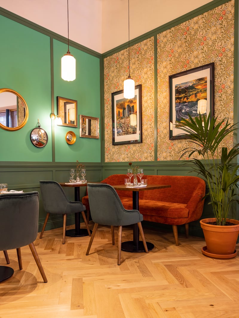 Chequer Lane: much juggling has been required by our waiter to fit the dishes on our small table, from which we have a view of the back of the service station, where napkins are being folded