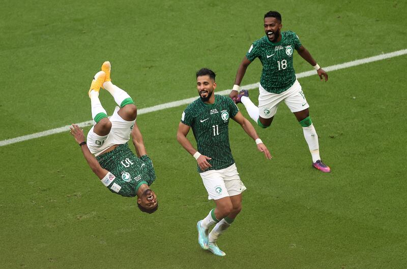 Salem Al-Dawsari of Saudi Arabia celebrates with team-mates after scoring his side's second goal in the Group C match against Argentina in Lusail City, Qatar. Photograph: Julian Finney/Getty Images