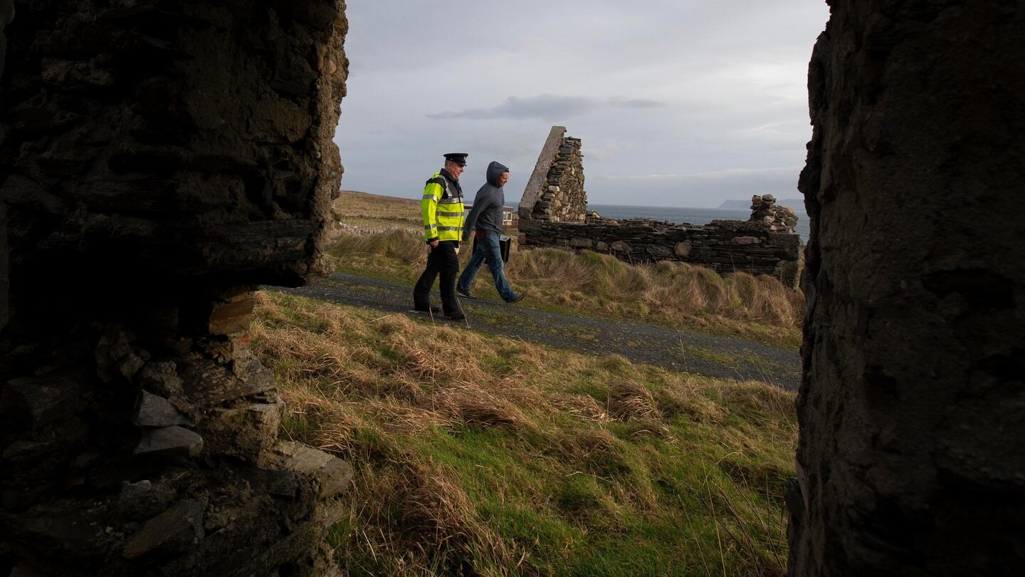 Presiding Officer, James Doohan and Garda Eamonn Gallagher carry Ballot boarrive on Inishbofin Island from an Air Corps helicopter in Co Donegal . Photograph: Colin Keegan, Collins Dublin
