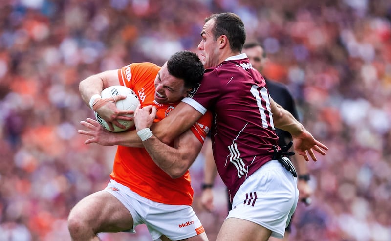 Armagh's Aidan Forker ais challenged by John Maher of Galway. Photograph: Bryan Keane/Inpho