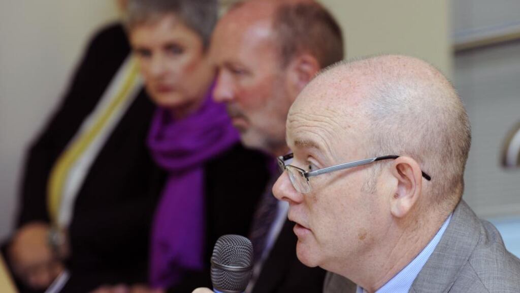 Hiqa chief executive Phelim Quinn speaking at the publication of the Patient Safety Investigation Report into services at Portlaoise. Behind him are Prof James Walker and Mary Dunnion. Photograph: Dave Meehan.