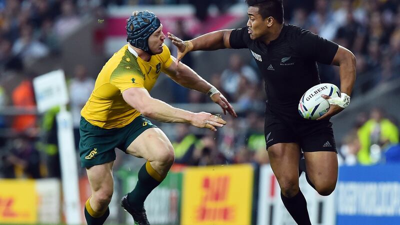 New Zealand’s wing Julian Savea (R) runs to evade Australia’s number 8 David Pocock. Photograph: Gabriel Bouys/AFP via Getty
