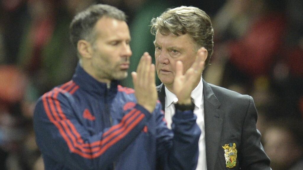 Ryan Giggs and Manchester United manager Louis van Gaal  leave the pitch at the final whistle following the scoreless draw against Chelsea at Old Trafford. Photograph: Oli Scarff/AFP