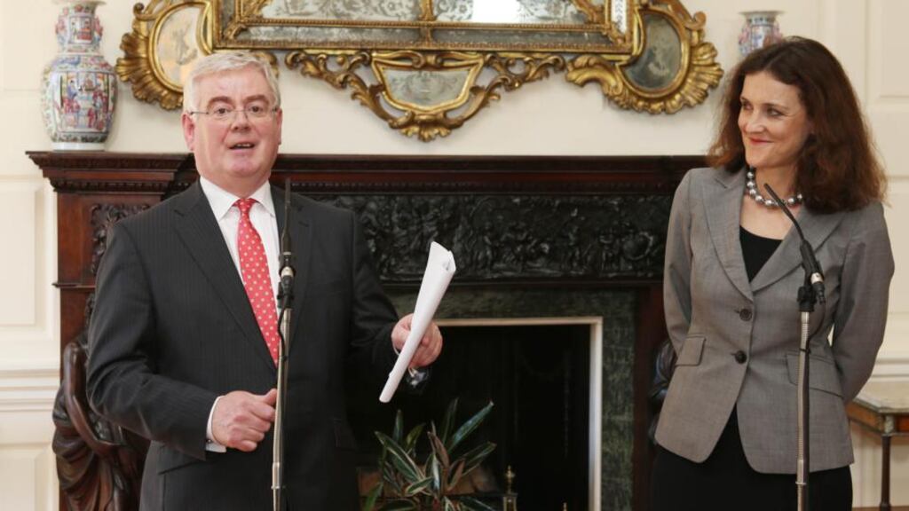 Secretary of State for Northern Ireland Theresa Villiers and Tanaiste Eamon Gilmore speak to the media at Iveagh House in Dublin. Photograph: Niall Carson/PA Wire