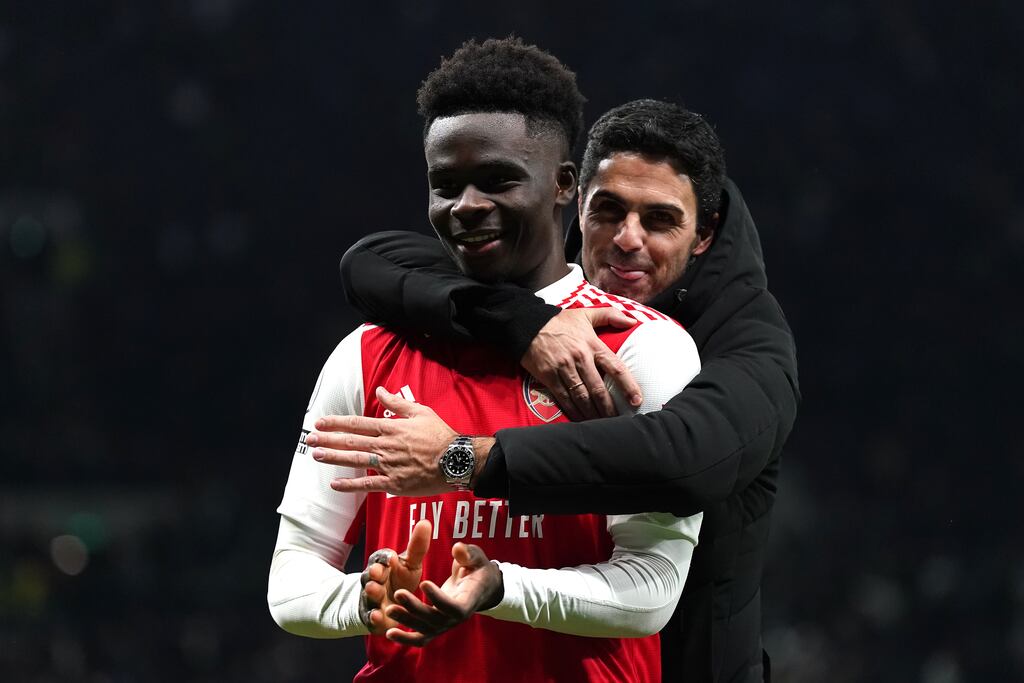 Arsenal winger Bukayo Saka with manager Mikel Arteta. Photograph: Nick Potts/PA