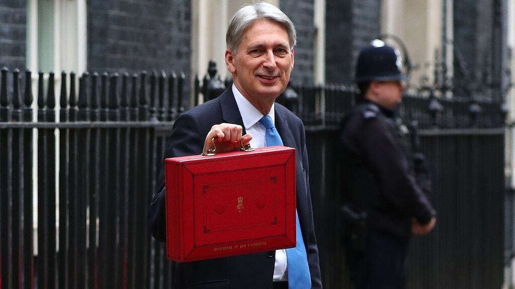 Britain’s chancellor of the exchequer Phillip Hammond poses with the budget box at 11 Downing Street in London. Photograph: Neil Hall/EPA