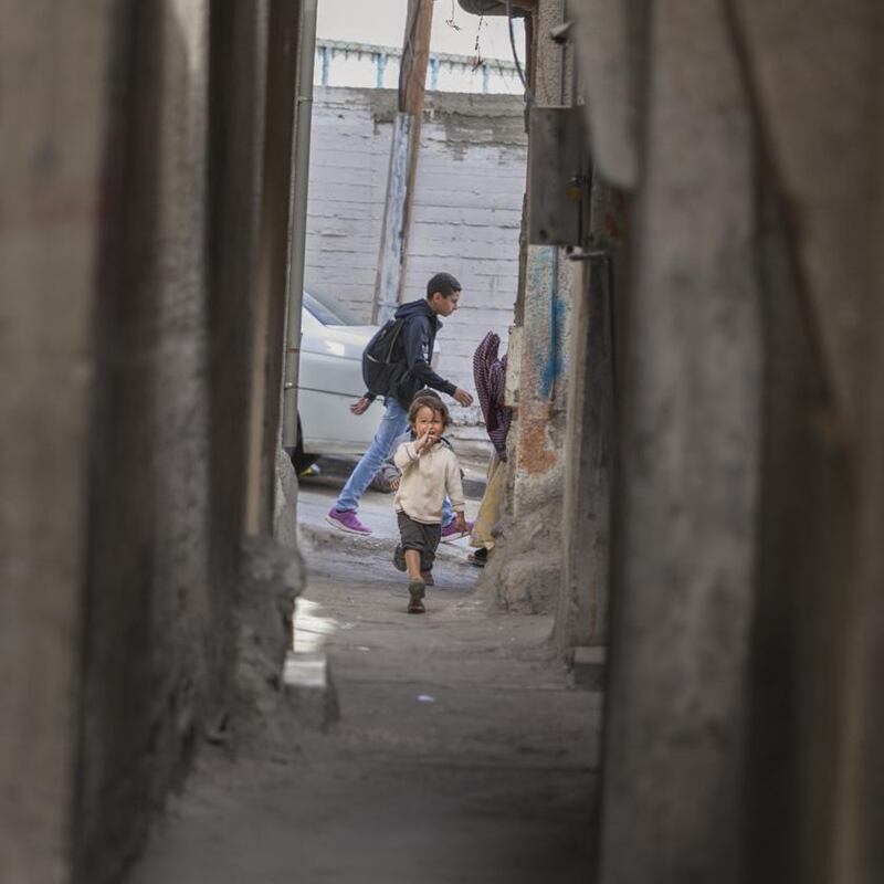 A child plays in the narrow streets of the Balata refugee camp in the West Bank. Photograph: Niall Sargent