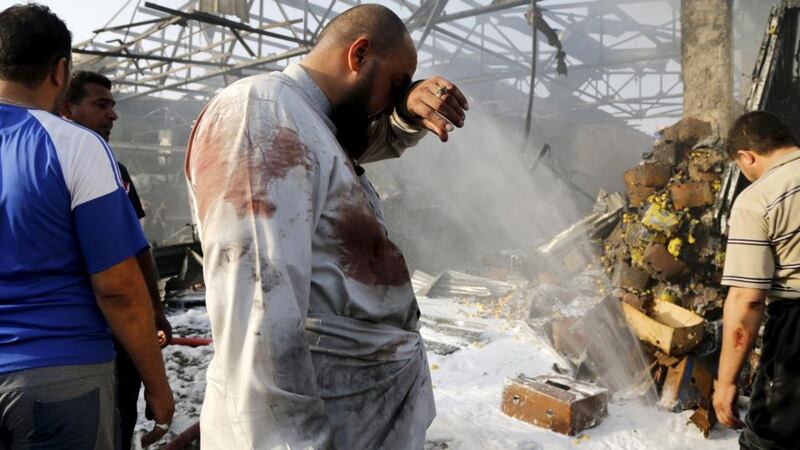 A man reacts at the site of the truck bomb. Photograph: Wissm Al- Okili/Reuters