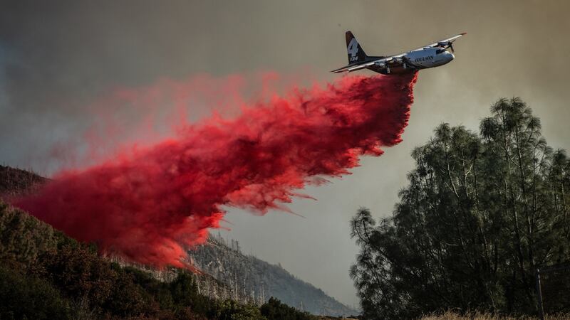 A plane drops fire retardant ahead of the Kincade Fire, in the Geysers, a geothermal field in California on Friday. Photograph: The New York Times