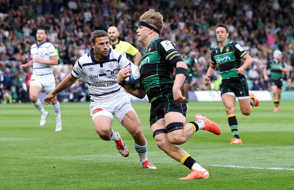 Henry Pollock of Northampton Saints breaks clear of Jeremy Fernandez to score their fifth try. Photograph: David Rogers/Getty