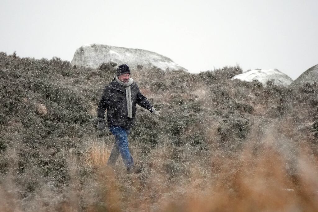 A man walks at the Wicklow Gap mountain pass in Co Wicklow as Ireland enters a cold snap. Photograph: Niall Carson/PA Wire